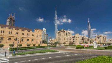 Amazing view of Dubai Skyline timelapse hyperlapse. Residential and Business Skyscrapers in Downtown, traffic on the road. Dubai, UAE. Blue cloudy sky. Palms on the street clipart