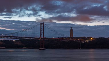 Lisbon city before sunrise with April 25 bridge night to day transition timelapse, Cristo Rei and lighthouse early morning