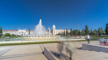 Jeronimos monastery and fountain seen from the Imperio garden timelapse hyperlapse in Lisbon, Portugal. People walking around and making pictures