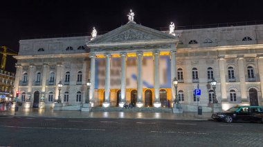 Rossio square in front of the illuminated National Theater Dona Maria II night timelapse hyperlapse in the capital of Portugal. Lisbon