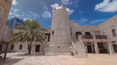 Historic fort at the Museum of Ajman timelapse hyperlapse with blue sky, United Arab Emirates. Stairs near tower clipart