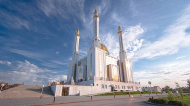 Nur Gasyr Mosque Timelapse Hyperlapse in Aktobe City. Blue Cloudy Sky Sets the Stage for a Tranquil Sunset in the Spiritual Heart of Kazakhstan clipart