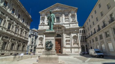 San Fedele Church with Alessandro Manzoni Statue timelapse hyperlapse, important Italian writer and poet of the nineteenth century, Milan city center, Italy. Blue sky at summer day clipart