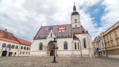 Church of St. Mark timelapse hyperlapse and parliament building in downtown Zagreb, Croatia. Cloudy sky