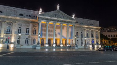 Rossio square in front of the illuminated National Theater Dona Maria II night timelapse hyperlapse in the capital of Portugal. Lisbon