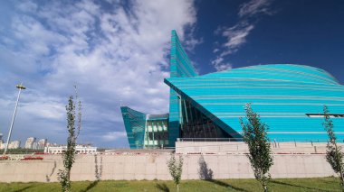 Kazakhstan Central Concert Hall timelapse hyperlapse located in the administrative center, unique in its architectural design, the biggest concert of the capital structure. Nur-Sultan city, Kazakhstan clipart