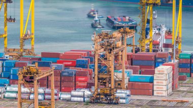 Port of Singapore timelapse. Bird eye panoramic aerial view of busiest Asian cargo port with hundreds of ships loading export and import goods and thousands of containers in harbor