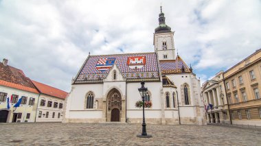 Church of St. Mark timelapse hyperlapse and parliament building in downtown Zagreb, Croatia. Cloudy sky