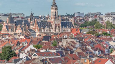 Aerial view of Schaerbeek Town Hall timelapse in Brussels, Belgium. Neo-Renaissance architecture surrounded by red-roofed houses under a blue cloudy sky. Scenic cityscape and historical charm clipart