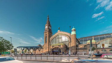 Entrance to Hamburg Hauptbahnhof timelapse hyperlapse, the main railway station, Germany. Classified as a category 1 station by Deutsche Bahn. Traffic and activity around the historic structure clipart