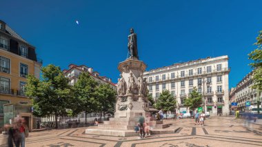 Camoes Monument in Luis de Camoes Square in the Chiado neighborhood timelapse hyperlapse. It comprises a tall bronze statue of the national poet. Walking area with historic buildings. Lisbon, Portugal clipart