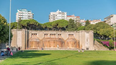 Timelapse hyperlapse of Fonte Luminosa fountain in Alameda Park, Lisbon. Iconic landmark celebrating water supply to the city's eastern district. Residential buildings in view. Portugal clipart