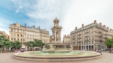 Hyperlapse of Place des Jacobins in Lyon, France, featuring the ornate Fontaine des Jacobins surrounded by historic buildings. Bustling city square under a cloudy sky timelapse clipart