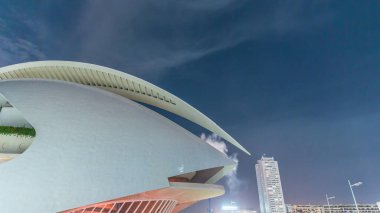 Aerial timelapse of the Palau de les Arts Reina Sofia in Valencia during a fireworks show. Iconic opera house by Calatrava featuring futuristic curves and reflecting pools at night. Spain. clipart