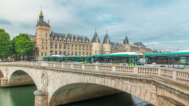 Castle Conciergerie timelapse - former royal palace and prison. Bridge to Change. Conciergerie located on the west of the Cite Island. Part of larger complex Palais de Justice. Paris, France. clipart