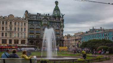 Singer House and Fountain Near Kazan Cathedral Timelapse, Amidst Cloudy Weather in Enchanting St. Petersburg, Russia. clipart