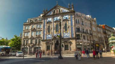 Almeida Garret Square near the Sao Bento railway station with Congregados Church facade at the front timelapse hyperlapse, Porto, Portugal.