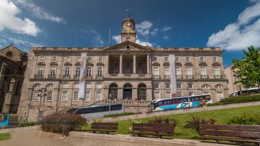 The Palacio da Bolsa timelapse hyperlapse. Stock Exchange Palace with Tower with clock and vane is a historical building in Porto, Portugal