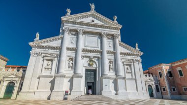 Facade of Church of San Giorgio Maggiore on the island timelapse hyperlapse. One of the main attractions of Venice front view. Blue sky at summer day.