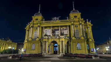 The building of the Croatian National Theater illuminated at night timelapse hyperlapse. Front view