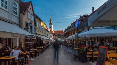 Street ivana racica timelapse hyperlapse in Croatian capital Zagreb. During sunny day in summer is overcrowded by locals and tourists having lunch in one of many surrounding restaurants. Croatia