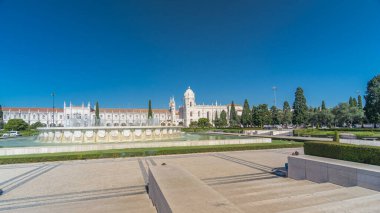 Jeronimos monastery and fountain seen from the Imperio garden timelapse hyperlapse in Lisbon, Portugal. People walking around and making pictures