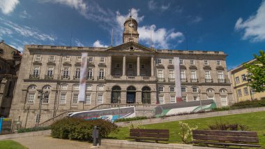 The Palacio da Bolsa timelapse hyperlapse. Stock Exchange Palace with Tower with clock and vane is a historical building in Porto, Portugal