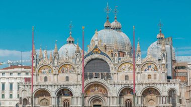 Front view of Basilica of St Mark timelapse. It is cathedral church of Roman Catholic Archdiocese of Venice. It lies at Piazza San Marco. Tourists walking in front of it. Venice, Italy