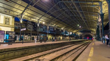 Trains departing at the platform of Sao Bento Train Station timelapse in Porto, Portugal. Built in 1916, this station is important transportation network and famous landmark.