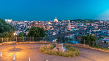 Panoramic cityscape view from the Pincio Landmark day to night transition aerial timelapse in Rome, Italy on a beautiful warm spring evening