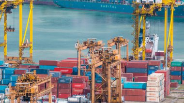 Port of Singapore timelapse. Bird eye panoramic aerial view of busiest Asian cargo port with hundreds of ships loading export and import goods and thousands of containers in harbor