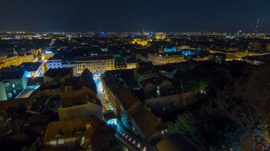 Old town of Zagreb at night timelapse. Zagreb, Croatia. Top panoramic view from Kula Lotrscak tower viewpoint with illuminated streets