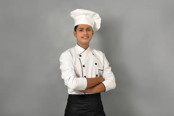 Happy male Indian chef Standing over grey background profession and people concept