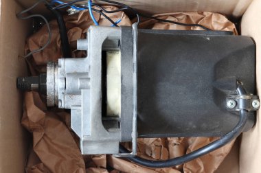 Old circular motor. The engine burned out in the box.