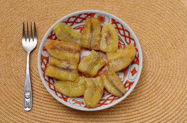 plate with chinese dessert fried banana slices