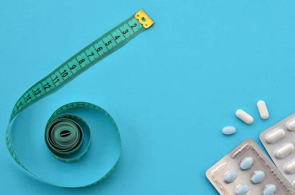 Ölçüm bandı ve diyet hapları