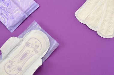 pads on a purple background close-up flat lay
