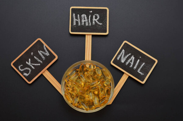 omega 3 dietary supplement for beauty skin, hair and nails, concept photo