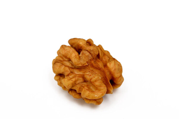 Peeled walnut isolated on white background closeup