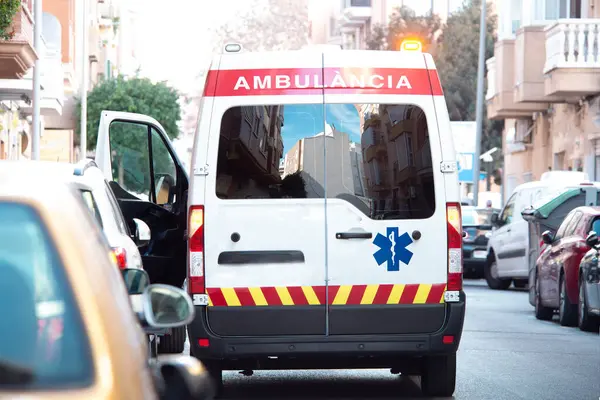 Stock image Ambulance parked on city street with open door. Emergency, rescue service, medical care