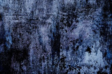 Sert desenli, pürüzlü ve koyu mavi ve mor tonlu yaşlı yüzey 2025 yılının alacakaranlığı, pantonu, grunge,