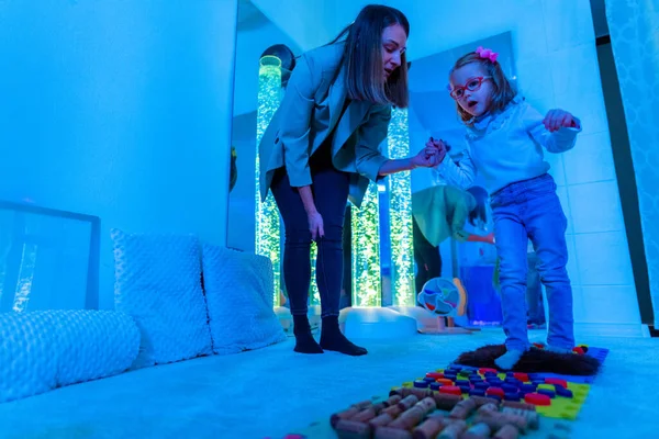 Child Therapy Sensory Stimulating Room Snoezelen Autistic Child Interacting  Colored Stock Photo by ©andreaobzerova 411404934