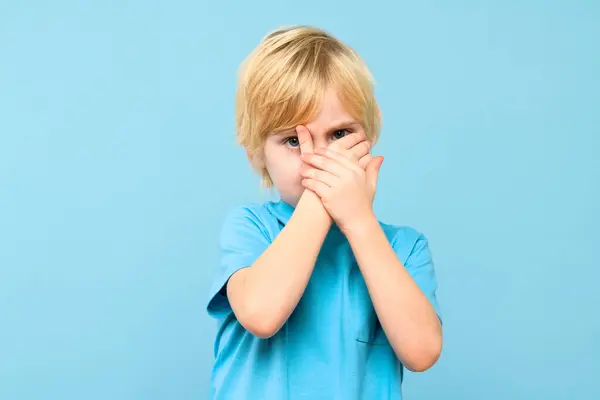 Emotional Young Boy Covering Face Hands Isolated Pastel Blue Background — Stock Photo, Image