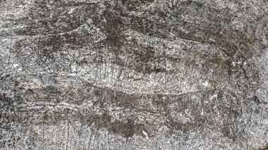Çatlak, aydınlık ve koyu renkli doğal taşın dokusu..