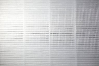 Dokulu bir arkaplan ton ve ışık çeşitliliğine sahip hassas bir ızgara içerir..