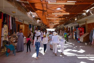 Deir el-Bahri, Egypt - July 08, 2017 Visitors Explore the Vibrant Tourist Market Near the Mortuary Temple of Hatshepsut in Egypt clipart