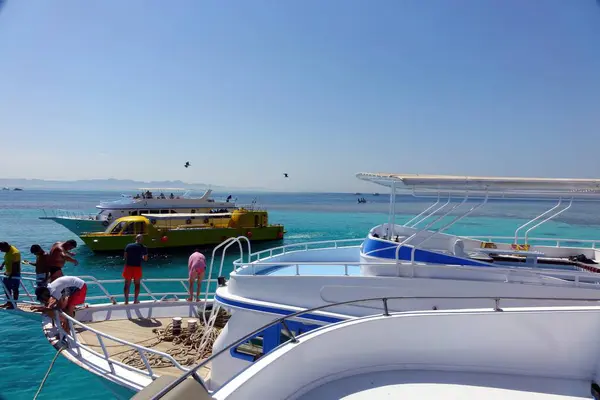 stock image El Gouna, Egypt - July 09, 2017 - Yacht Anchored in the Red Sea at a Resort in Egypt With Guests Enjoying the Sunny Day