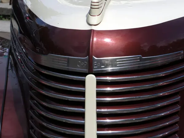 stock image Lviv, Ukraine - June 5, 2016 A beautifully restored vintage car Opel Kapitan 1931 showcases its front grille adorned with chrome details at a lively local car show during autumn