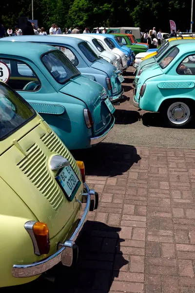 stock image Lviv, Ukraine - June 1, 2023 A variety of vintage cars ZAZ-965 Zaporozhets in pastel colors are parked in neat rows, showcasing their unique designs. Enthusiastic spectators admire the classic models