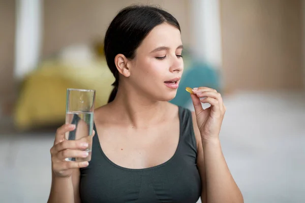 Beautiful Young Woman Taking Vitamin Pill Capsule Holding Glass Water — Stock Photo, Image